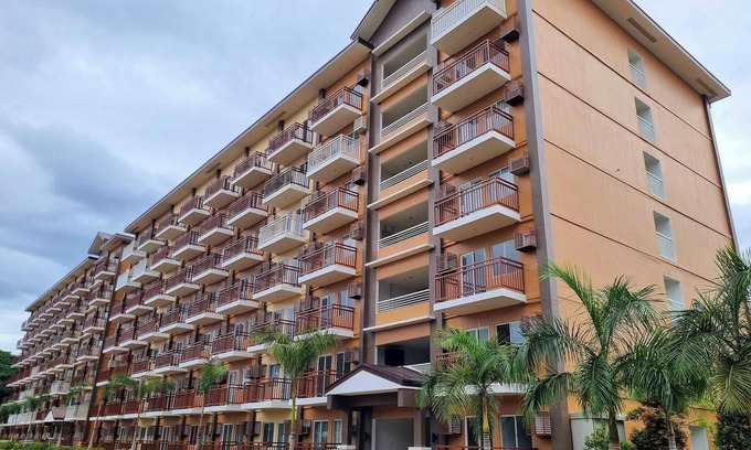 Puerto Princesa City Centre Condo | Studio 1queen Bed, sofa, kitchen and Balcony Puerto Princesa, Palawan