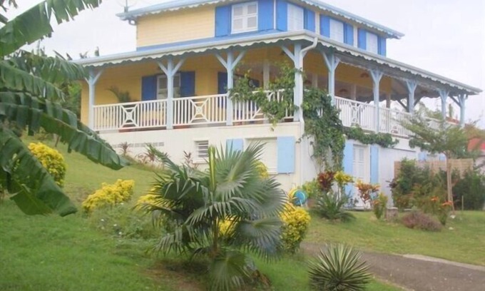 Le Francois Cottage | Charming Studio with Ocean View in Tropical Garden Retreat