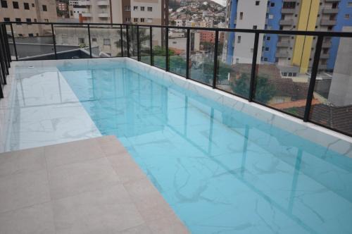 Sao Benedito Apartment | Central Studio with Ocean View and Pool Amenities