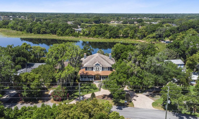 Heathrow House | Relaxing Lake House Retreat with Hot Tub and Canoe Access