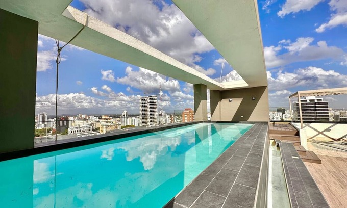 Yolanda Morales Condo | Central City Condo with Pool, AC & Family-Friendly Amenities