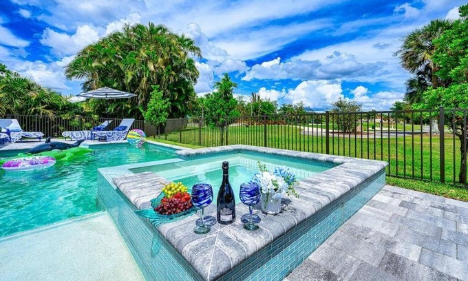 Central Naples House | Inviting Family Retreat with Pool, Spa & Ocean View