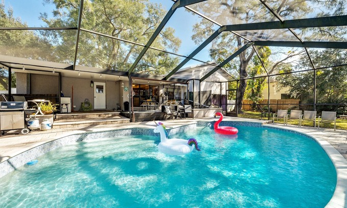 Temple Terrace House | Pet Friendly Getaway with Heated Saltwater Pool & Pond Views