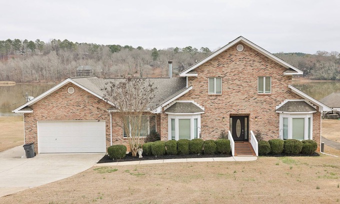 Riverside House | Lake House Retreat with Game Room and Pool Access