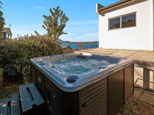 Acacia Bay House | Idyllic Lake Views with Hot Tub & Family-Friendly Amenities