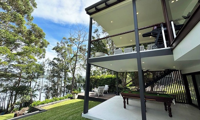Smiths Lake House | Stunning lakefront retreat on Smiths Lake. Swim, boat, & fish from the backyard!