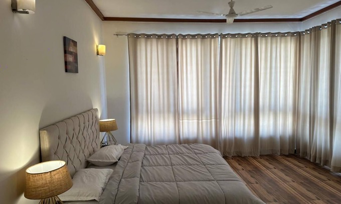 Noida Apartment | Modern Two Bedroom Apartment with Golf View & Pool Access