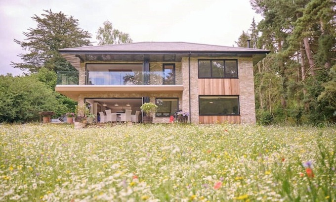 Norwich House | Modern River Retreat with Spa and Hot Tub Amenities