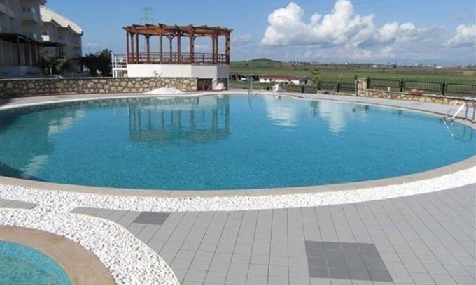 Side House | Inviting 2-Bedroom Home with Pool in Prime Location