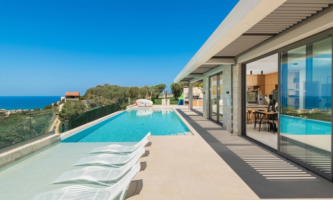 Stalos Villa | Seaside Retreat with Daily Cleaning, Spa & Pool Access