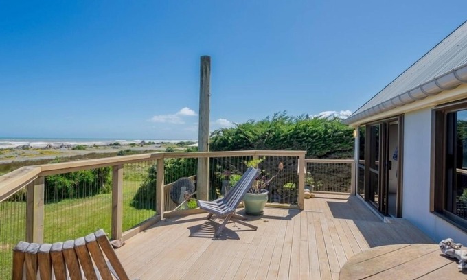 Te Horo Beach House | Beachfront Retreat with Ocean Views and Pool Amenities