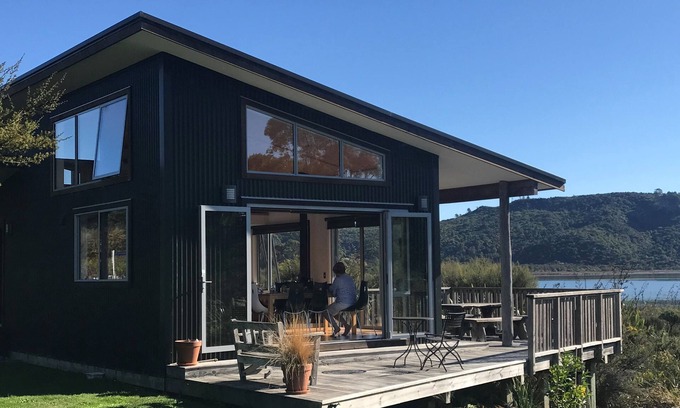 Parapara House | Serene Estuary-Front Retreat with Spa and Ocean Views