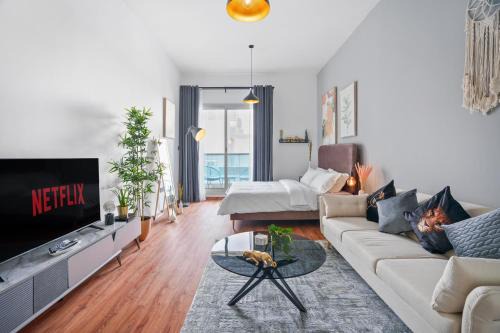 Dubai Sports City Apartment | Modern Studio Retreat at Sports City with Pool and Ocean Views