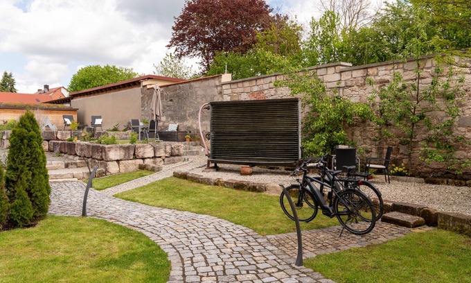 Rauhenebrach Condo | Stylish Apartment -Darre- with Pool & Spa in Historic Brewery