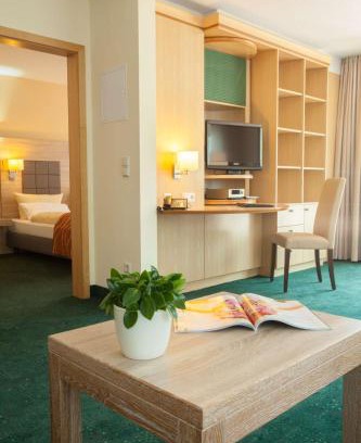 Ost Hotel | Inviting Suite Hotel Leipzig: Comfort with Hot Tub & Kitchen