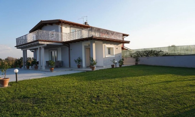 Ladispoli Apartment | Elegant Suite with Imperial Garden and Oceanfront Views