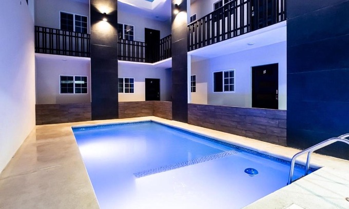 Juarez Municipality Apartment | Guest Rated Suites González: Family-Friendly with Pool Access