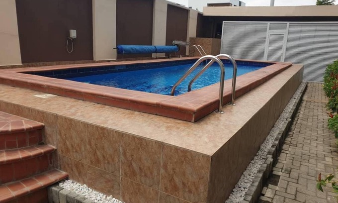 Ikoyi Apartment | Discover MacDonald Apartments: Family-Friendly Retreat with Pool