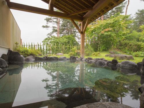 Misato Hotel | Relax at Sun R with Inviting Hot Tub Amenities