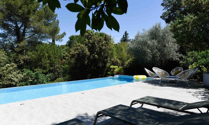 Aubais Villa | Relax in a Heated Pool with Ocean Views and Spa Amenities