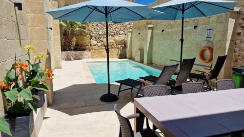 Xewkija House | Enchanting Sunflower Farmhouse: Oceanfront Retreat & Pool