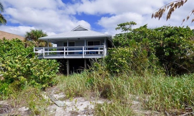 Placida House | Coastal Retreat: Beachfront Cottage with Private Dock