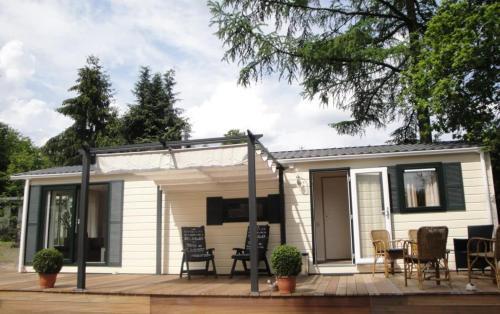 Beekbergen-West Ski Chalet | Discover Sunnychalet: Oceanfront Retreat with Pool Access