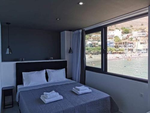 Vlachiana Apartment | Oceanfront Sunrise Seaside Apartment with Scenic Views