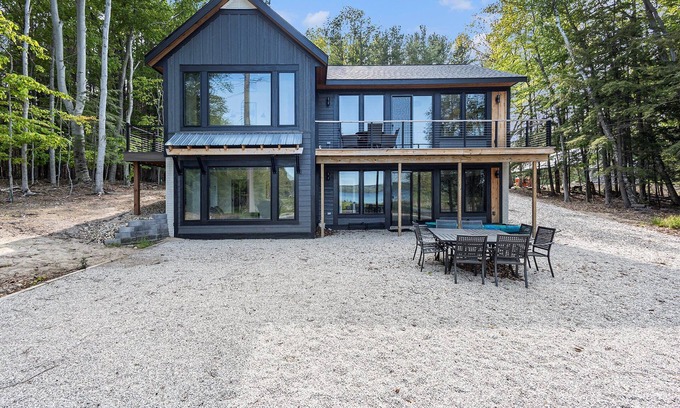 Kewadin House | Experience Sunrise Sands Retreat: Beachfront Oasis Awaits