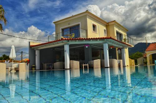 Acharavi Apartment | Oceanfront Bliss at SunRose Beach Aparthotel - 4 Stars