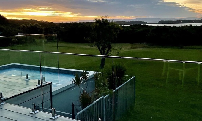 Culburra Beach House | Relaxing Retreat at Sunset: Waterfront with Ocean Views