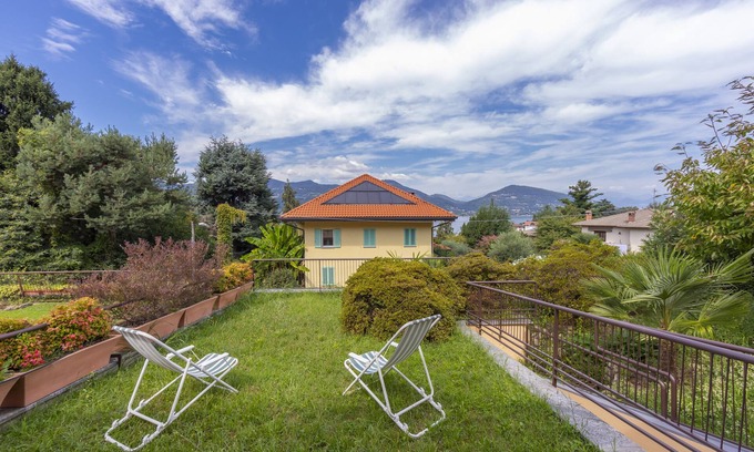 Ranco House | Pet-Friendly Getaway at Sunset in Ranco, Italy