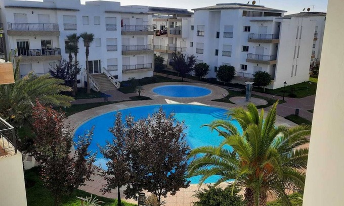 El Mansouria Apartment | Inviting Apartment with Pool Access in Prime Residence