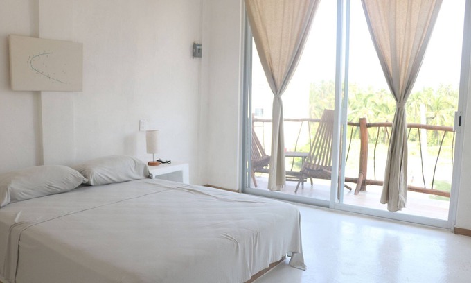 Ixtapa - Zihuatanejo Hotel | Inviting Queen Size Bedroom with Pool Access for Families
