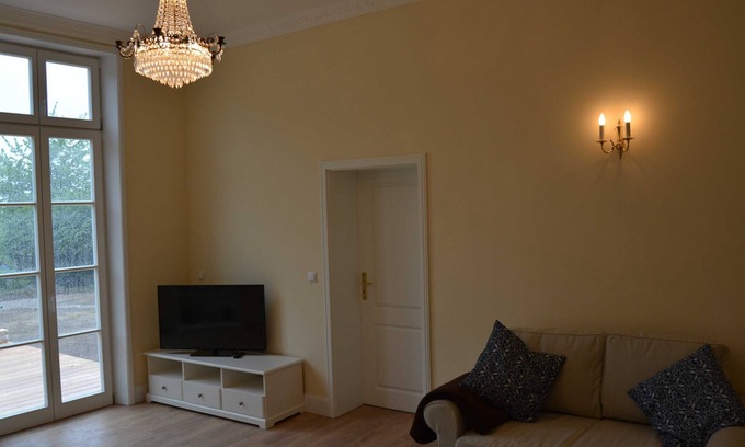 Hof Redentin Apartment | Scenic Swan Lake Retreat at Redentin Manor Awaits You