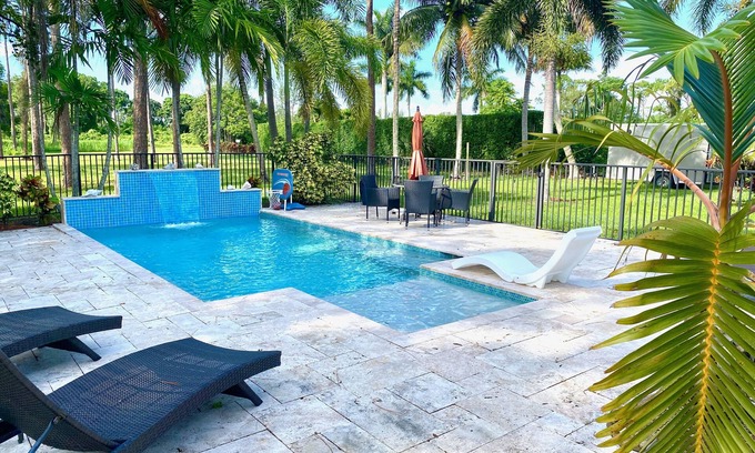 Lake Worth House | Discover Swans Nest East: Tropical Oasis with Heated Pool