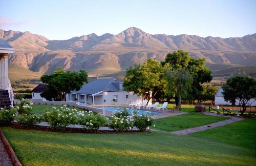 Oudtshoorn House | Discover Swartberg Country Manor: 4-Star Comfort & Pool