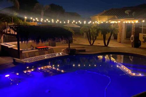 Adobe Highlands House | Relax by the Heated Pool with a Swim-Up Bar Experience