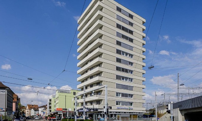 Oerlikon Apartment | Convenient Swiss Star Tower: Self Check-In & Family Friendly