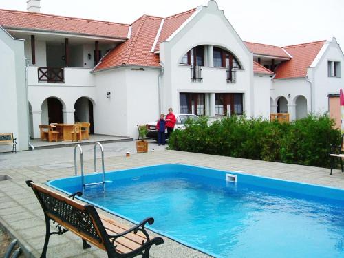 Hegyko House | Discover Szanyi Vendégház: Poolside Retreat for Families
