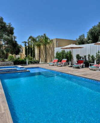 Ghajnsielem Villa | Experience Ta Benna Villa: Poolside Paradise with Ocean Views