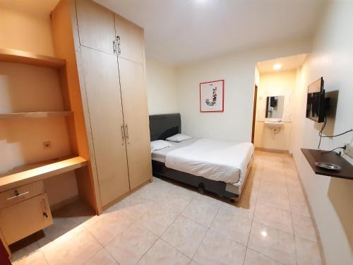 Jakarta House | Budget-Friendly Stay at KK Wisma Berkat - 4-Star Comfort