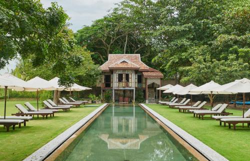 Kampung Kedawang Resort | Elegant Temple Tree Resort: Oceanfront Bliss Awaits