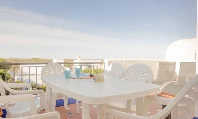 Poblado de Sancti Petri Apartment | Relax by the Pool, Steps from the Beach with Top Amenities