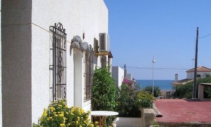 El Moncayo House | Charming Terrace Bungalow Steps from the Sandy Beach