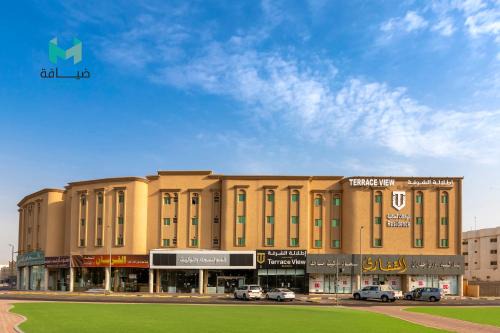 Dammam Apartment | Scenic Terrace View 3: Poolside Relaxation Awaits You