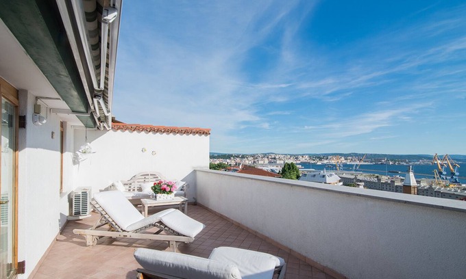 Roiano-Gretta-Barcola-Cologna-Scorcola Apartment | Explore The Attic of Wonders with Oceanfront Amenities