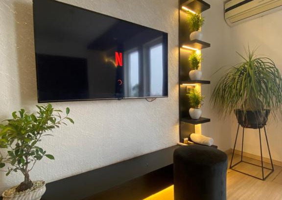 Gomti Nagar Apartment | Discover The Black House: Family-Friendly with Pool Access