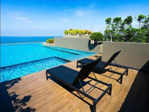 Saen Suk Apartment | Relax at The Blu X Seaview: Family-Friendly Pool Retreat