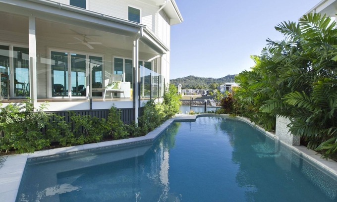 Nelly Bay House | Experience The Boathouse: Oceanfront Holiday Home Awaits